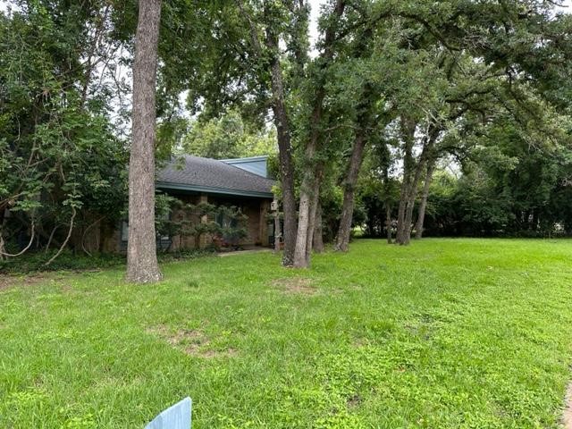 1705 Sager Road Rockdale, TX 76567 - Photo 1 of 1 a view of a wooden deck with a tree