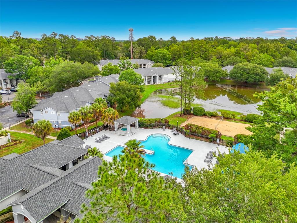 3705 Southwest 27th Street, Unit 922 Gainesville, FL 32608 - Photo 31 of 34 an aerial view of residential houses with outdoor space and swimming pool