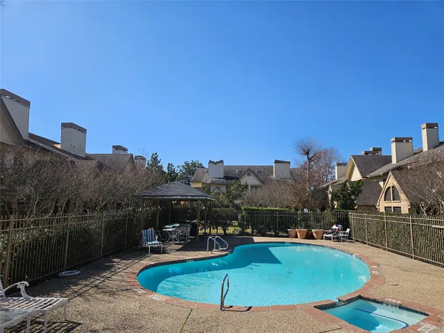 a view of a swimming pool and a chairs