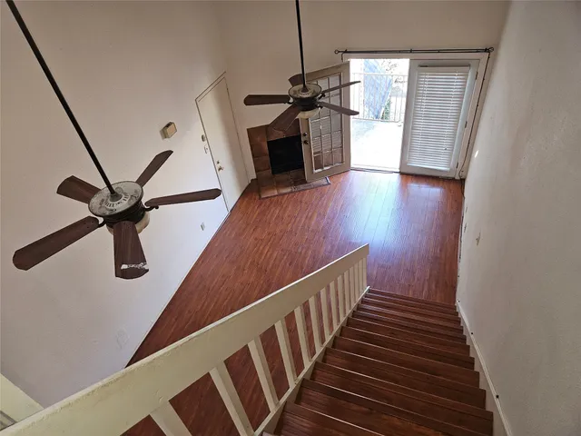 a view of hallway with wooden floor