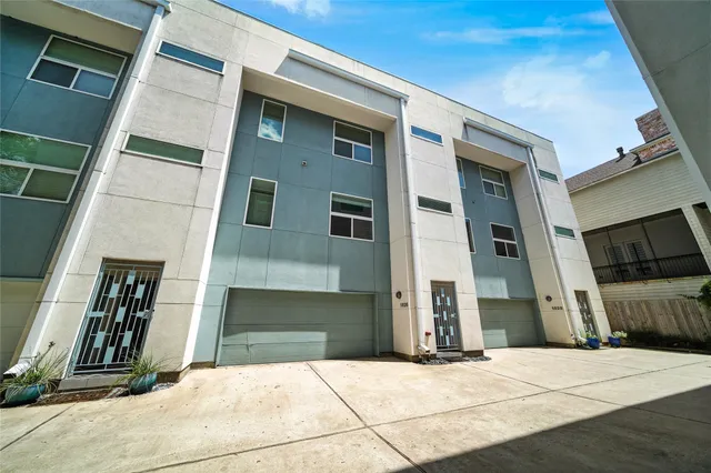 a front view of a house with a garage