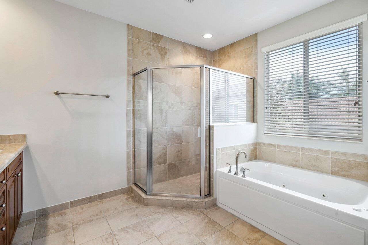 3025 Waterside Circle Boynton Beach, FL 33435 - Photo 18 of 36 a bathroom with a bathtub and a shower