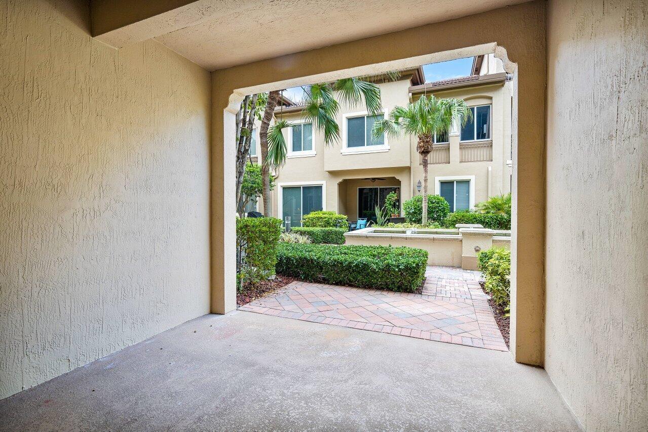 3025 Waterside Circle Boynton Beach, FL 33435 - Photo 30 of 36 a view of house with garden and porch