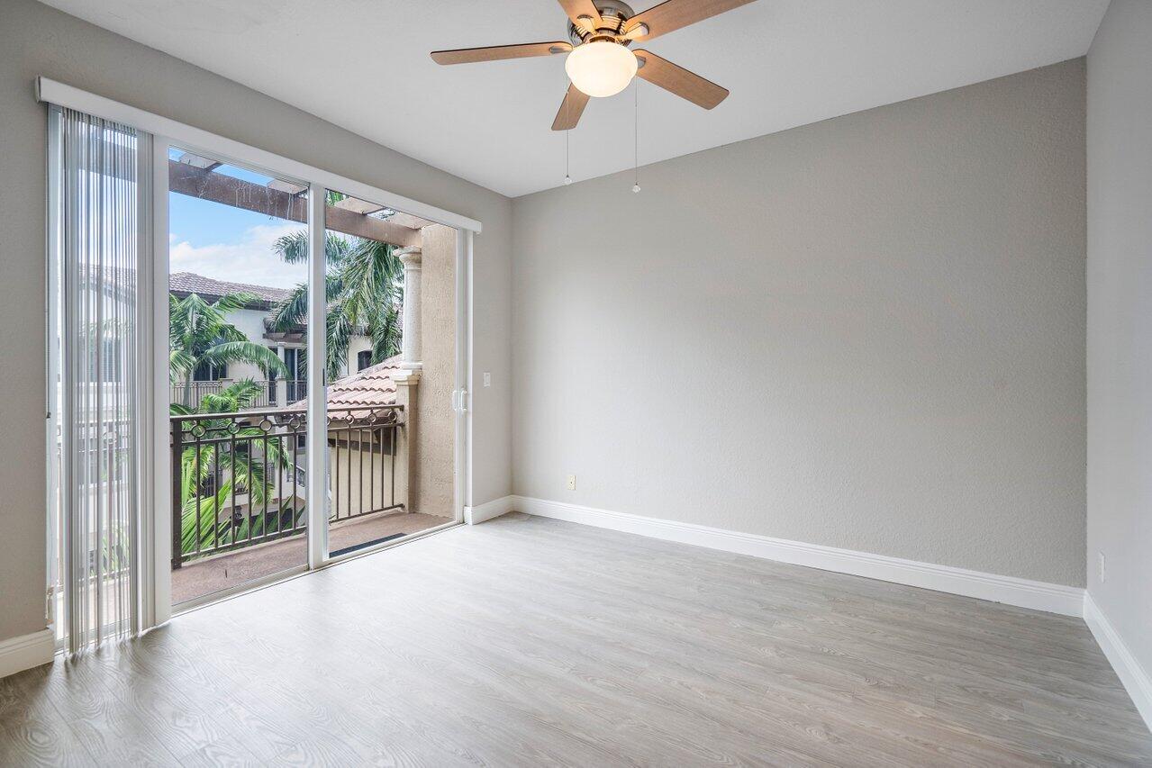 3025 Waterside Circle Boynton Beach, FL 33435 - Photo 5 of 36 wooden floor in an empty room with a window