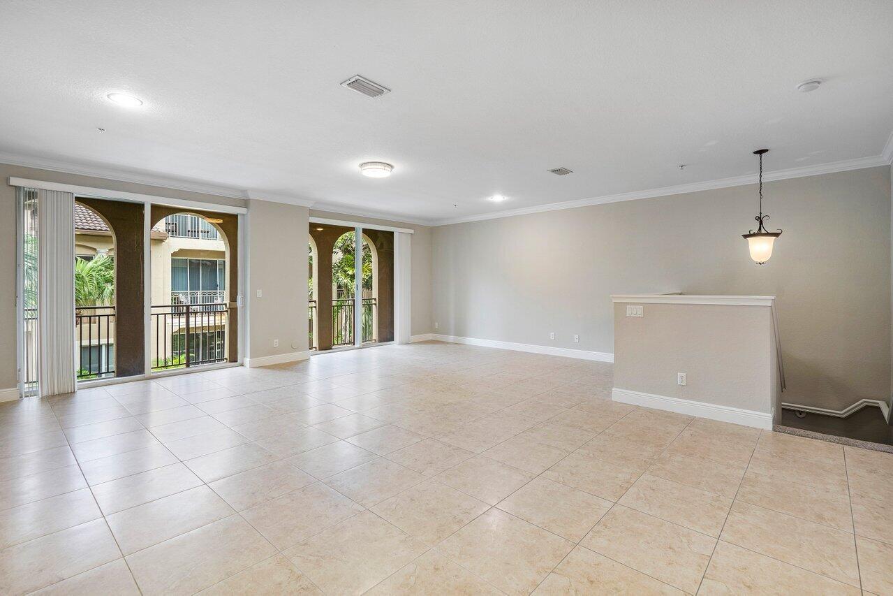 3025 Waterside Circle Boynton Beach, FL 33435 - Photo 9 of 36 a view of an empty room with glass door