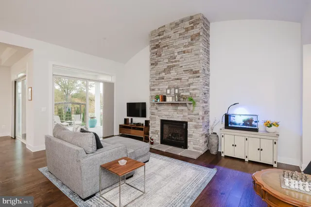 a large white kitchen with a table and chairs