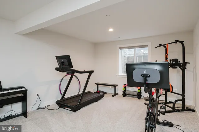 a view of a patio with table and chairs and potted plants