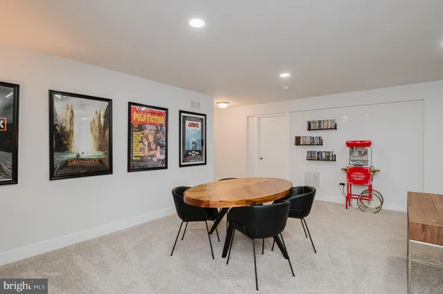 a view of a patio with table and chairs and potted plants