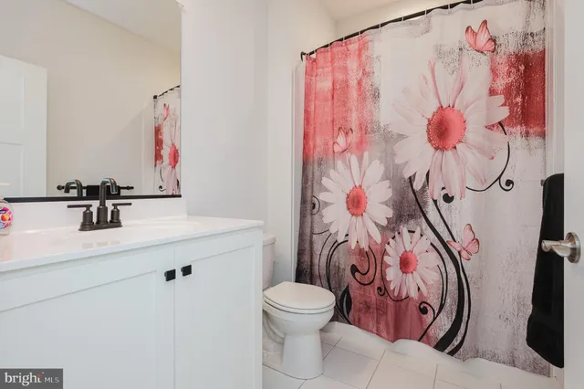 a living room with furniture fireplace and window