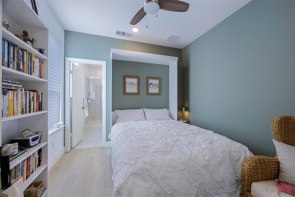 1311 Union Road Celina, TX 75009 - Photo 14 of 38 a bedroom with a bed and a book shelf