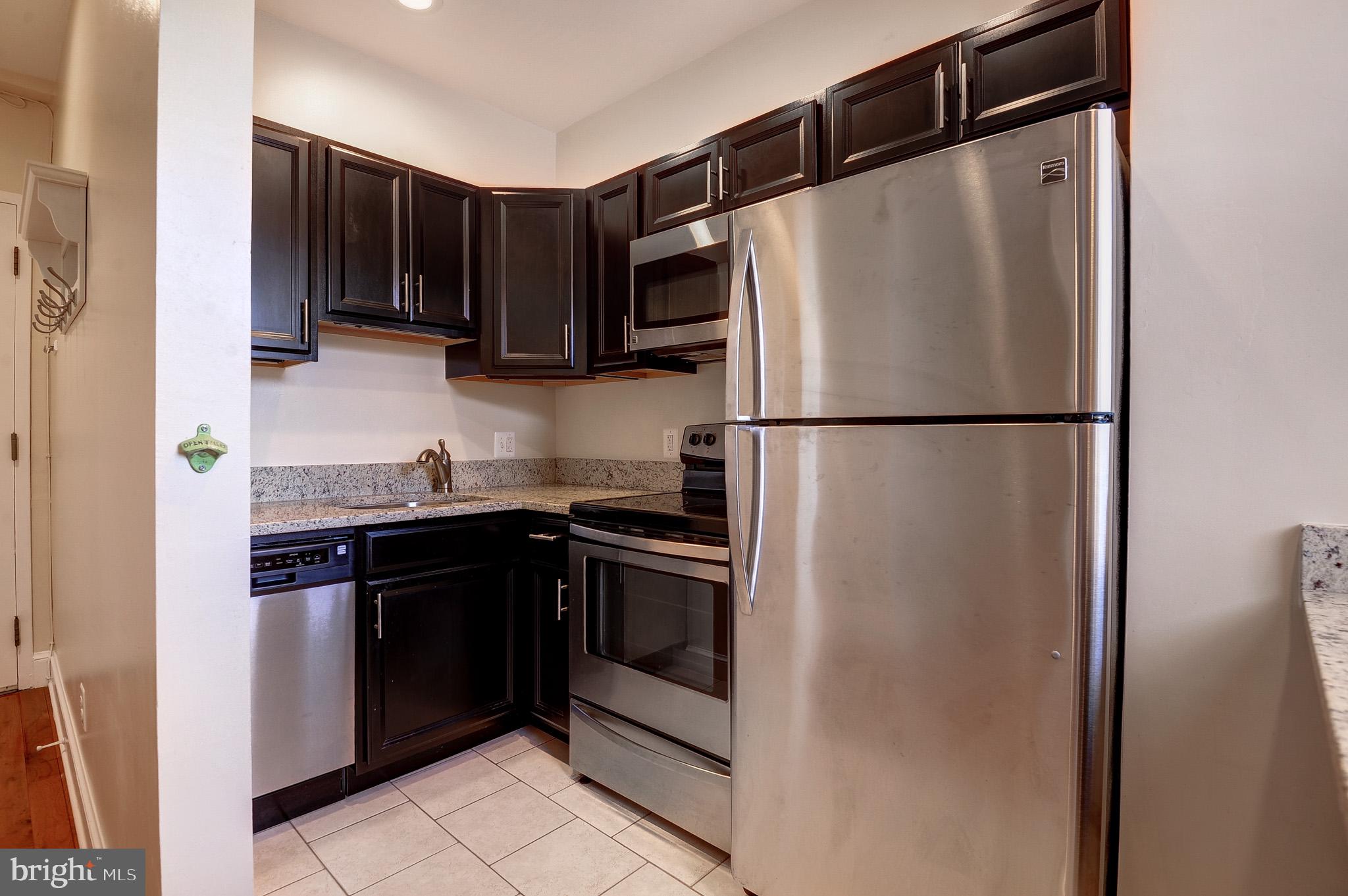 637 3rd Street Northeast, Unit 305 Washington, DC 20002 - Photo 4 of 16 Sleek modern kitchen with stainless steel.