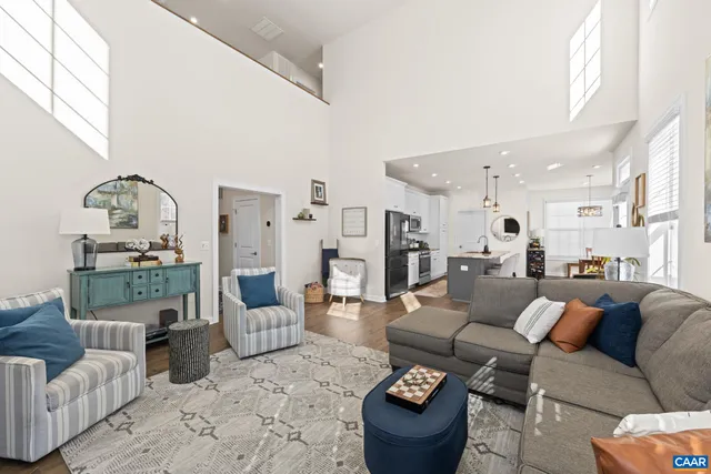 a kitchen with stainless steel appliances granite countertop a sink refrigerator and microwave