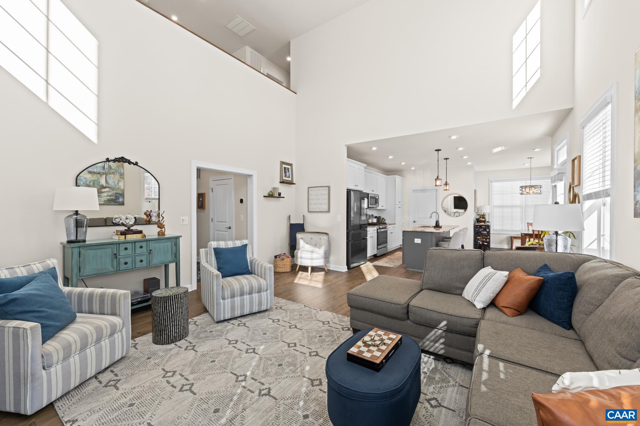 3490 Thicket Run Place Charlottesville, VA 22911 - Photo 13 of 63 a living room with furniture and a wooden floor