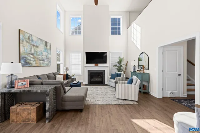 a kitchen with stainless steel appliances granite countertop a sink refrigerator and microwave