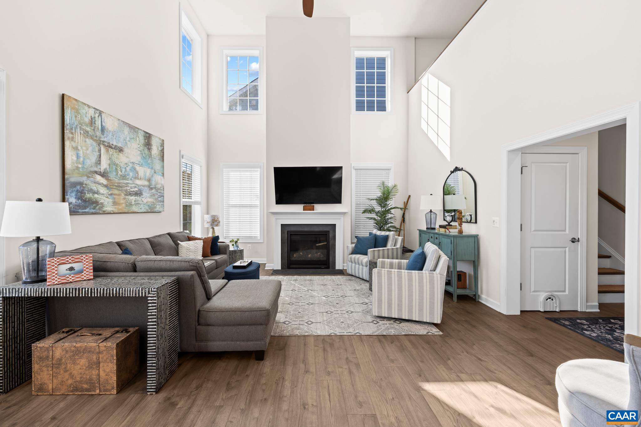 3490 Thicket Run Place Charlottesville, VA 22911 - Photo 15 of 63 a living room with furniture a fireplace and a flat screen tv