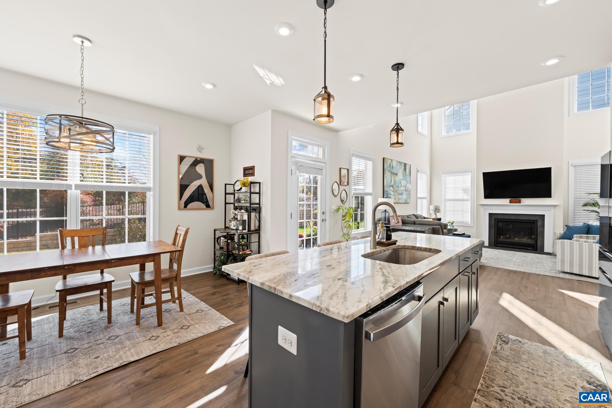 3490 Thicket Run Place Charlottesville, VA 22911 - Photo 22 of 63 a kitchen with center island table and chairs