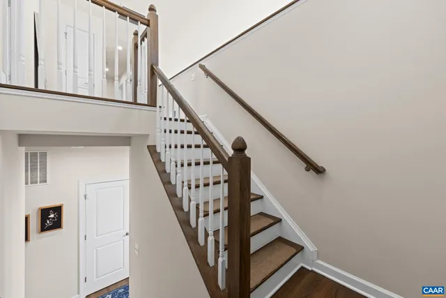 a view of walk in closet with clothes