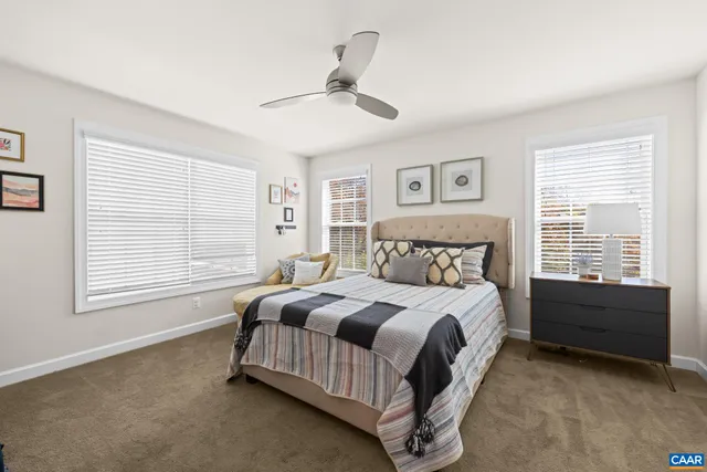 a bathroom with a double vanity sink mirror and shower