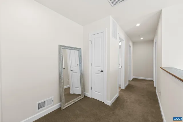 a bathroom with a double vanity sink mirror and shower