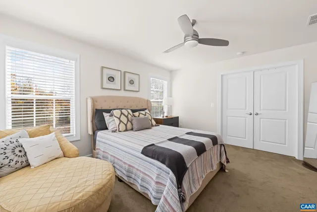 a bathroom with a double vanity sink mirror and toilet
