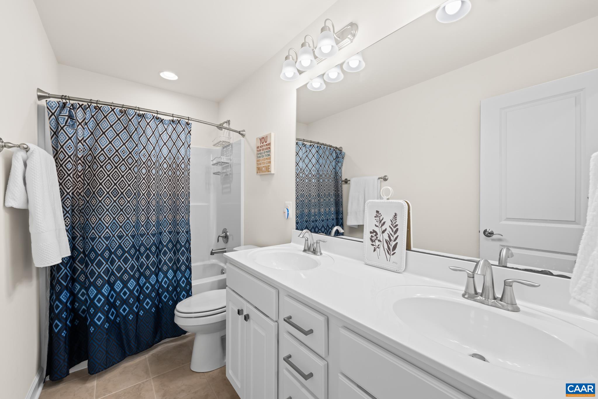 3490 Thicket Run Place Charlottesville, VA 22911 - Photo 31 of 63 a bathroom with a double vanity sink mirror and toilet