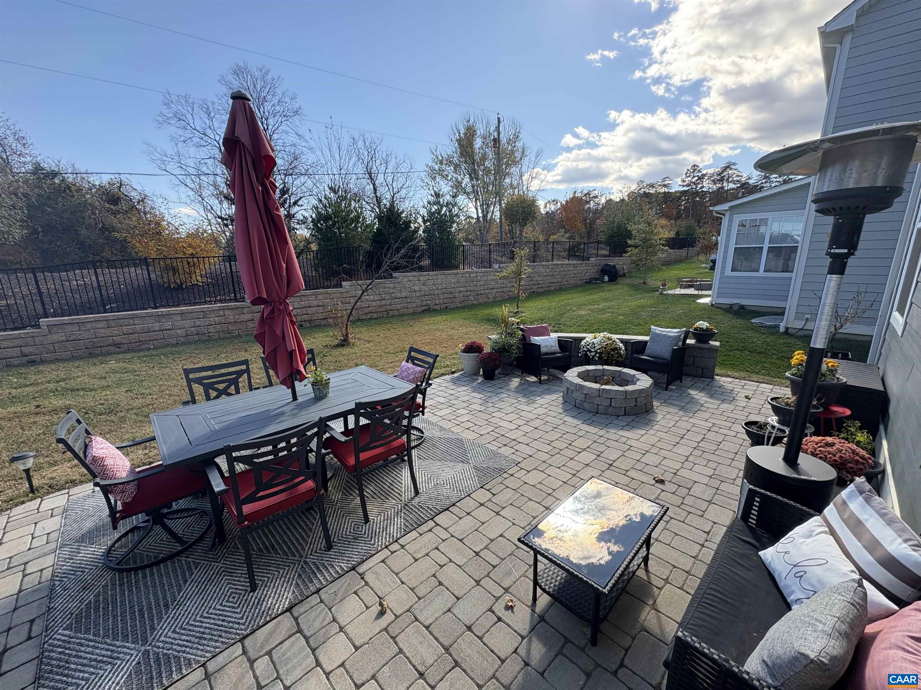 3490 Thicket Run Place Charlottesville, VA 22911 - Photo 44 of 63 a view of a patio with couches chairs and a fire pit