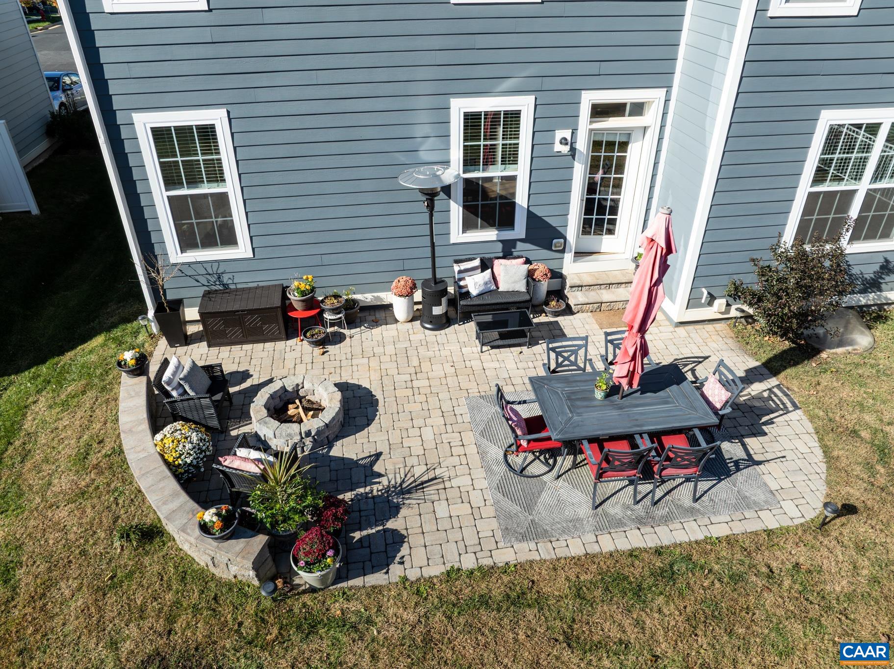 3490 Thicket Run Place Charlottesville, VA 22911 - Photo 48 of 63 a view of a dinning tables and chairs in patio