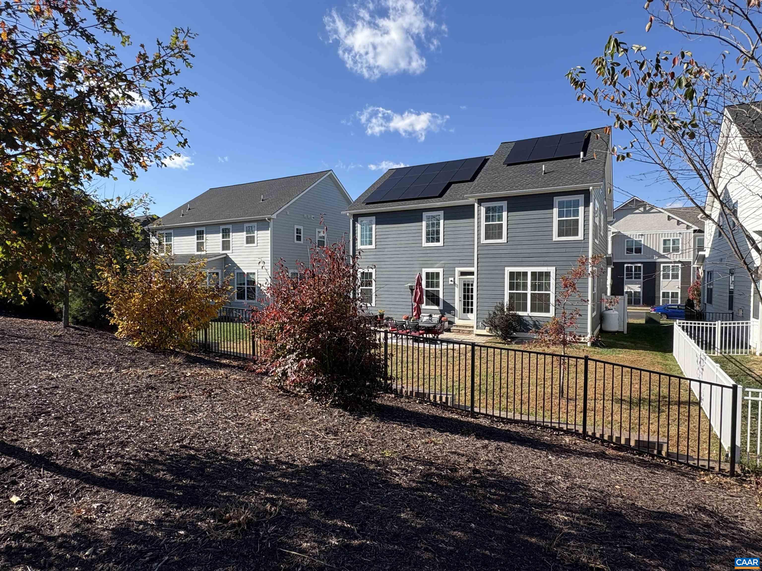 3490 Thicket Run Place Charlottesville, VA 22911 - Photo 50 of 63 a view of a house with a large tree and a yard