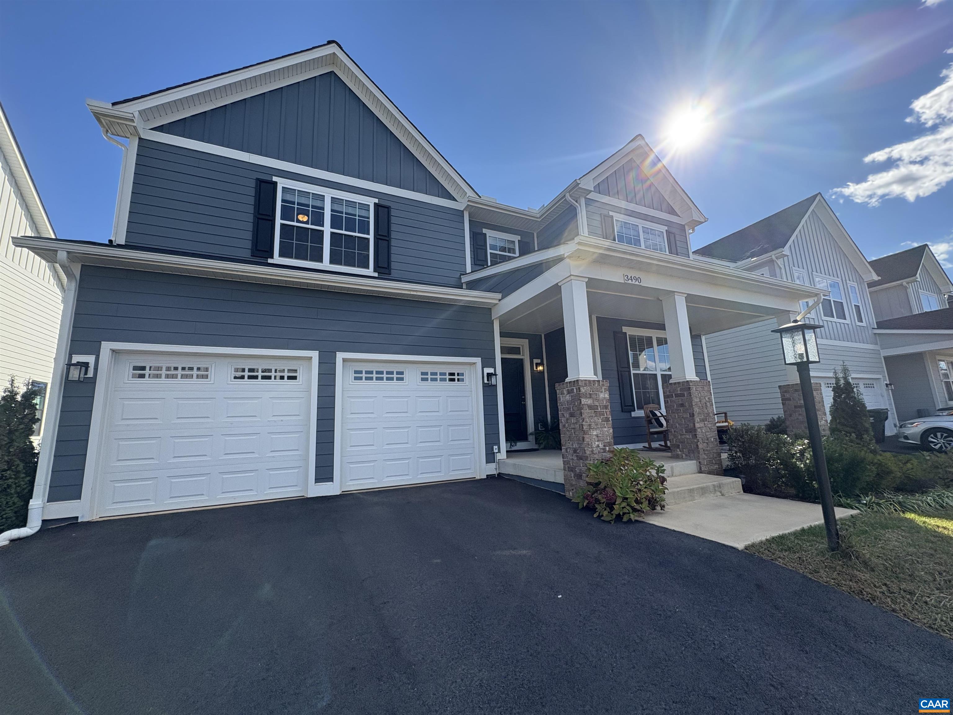 3490 Thicket Run Place Charlottesville, VA 22911 - Photo 52 of 63 a front view of a house with a yard and garage
