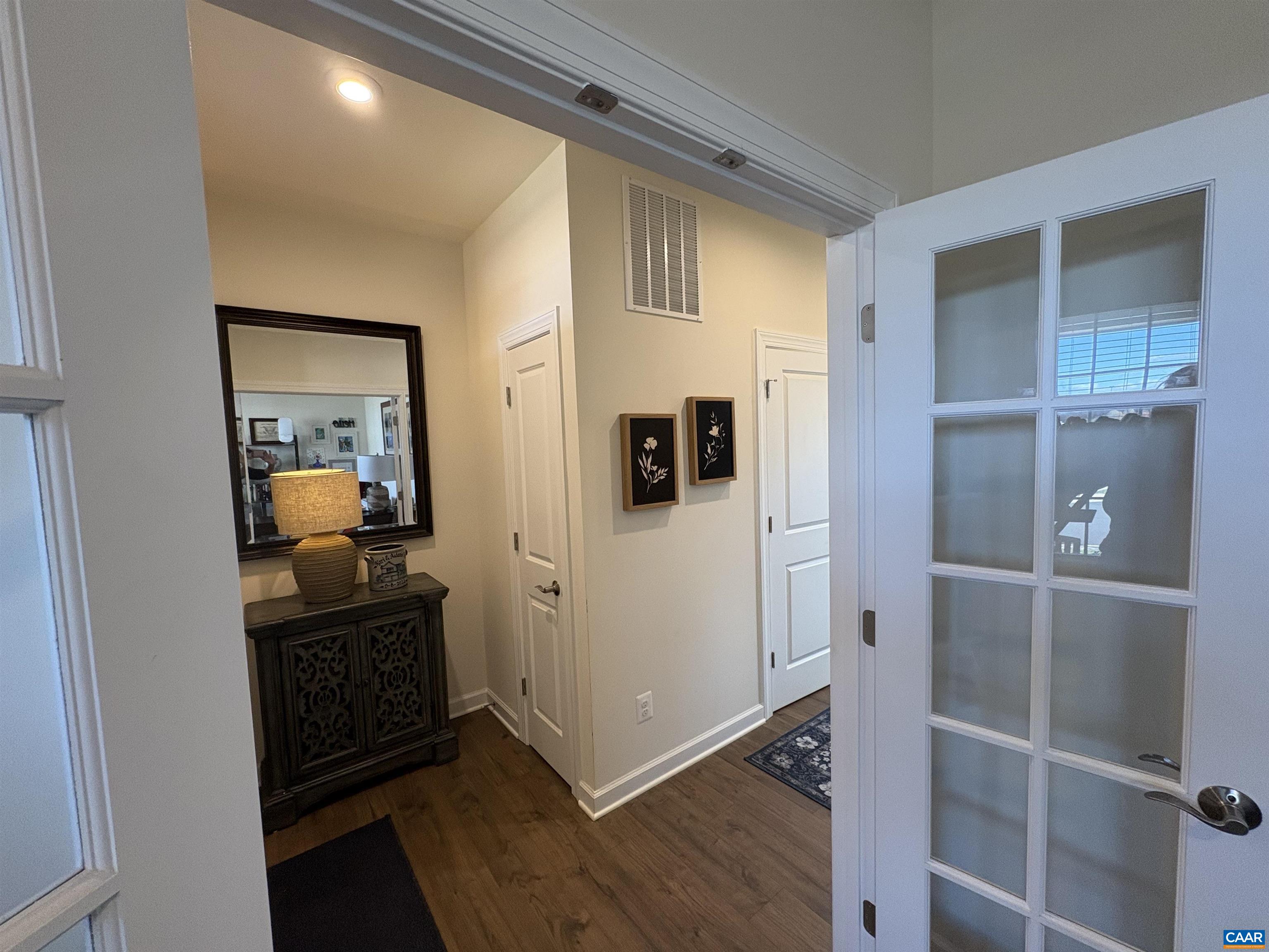 3490 Thicket Run Place Charlottesville, VA 22911 - Photo 8 of 63 a view of a hallway with dining room and wooden floor
