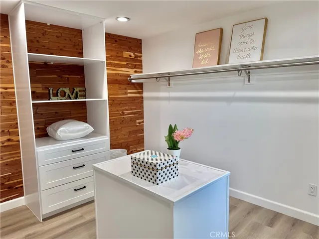 a bathroom with a sink a vanity and a shower