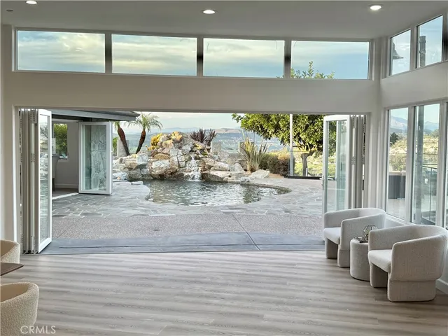 a lobby with furniture and a large window