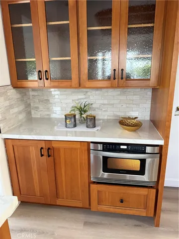 a kitchen with granite countertop a stove and a sink
