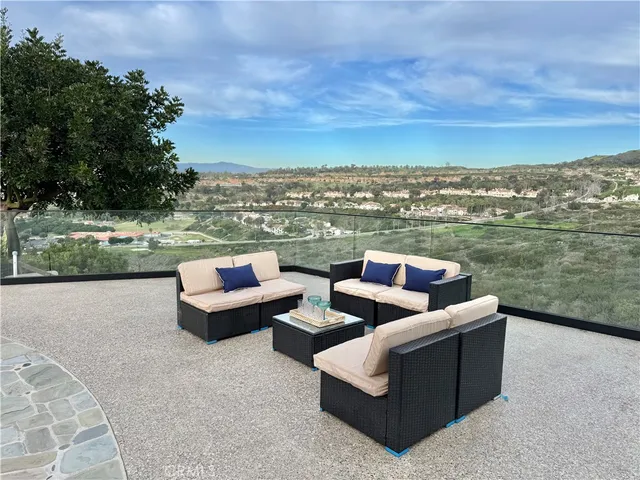 a view of a terrace with couches and a table