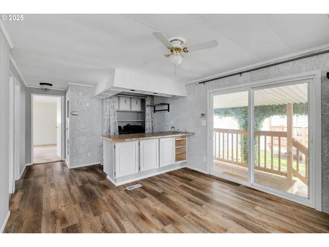 a living room with a couch and a window