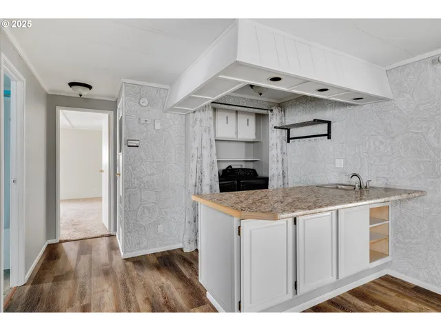 a kitchen with a sink and cabinets