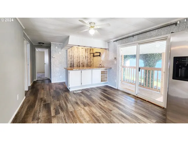 a en suite bathroom with a sink and a large window