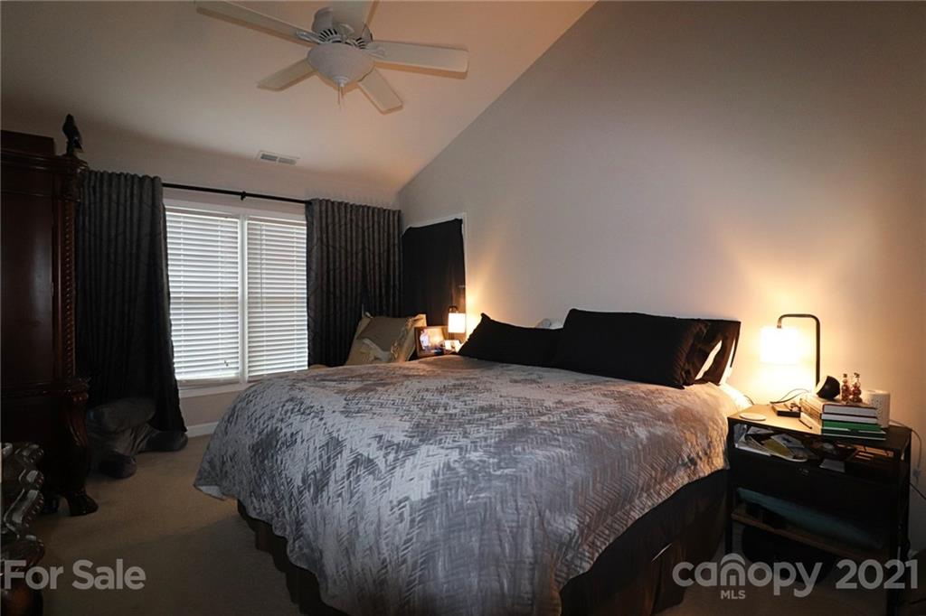 1139 Market Street Fort Mill, SC 29708 - Photo 11 of 17 a bedroom with a bed and a dresser