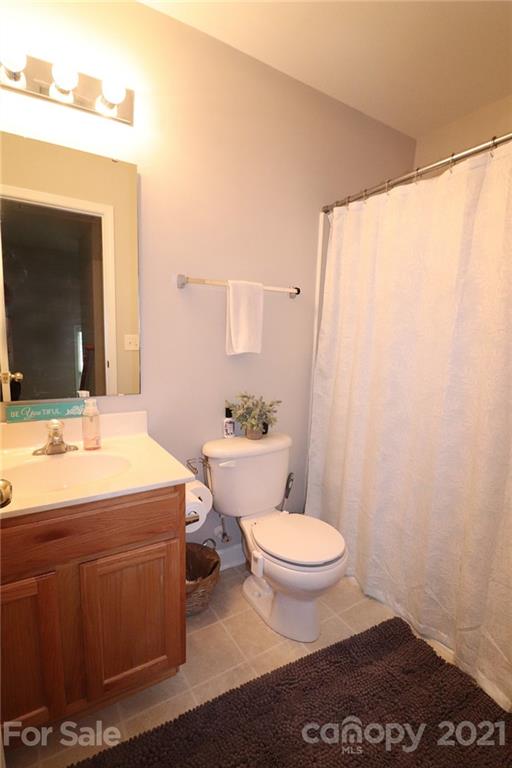 1139 Market Street Fort Mill, SC 29708 - Photo 15 of 17 a bathroom with a sink a toilet a mirror and shower