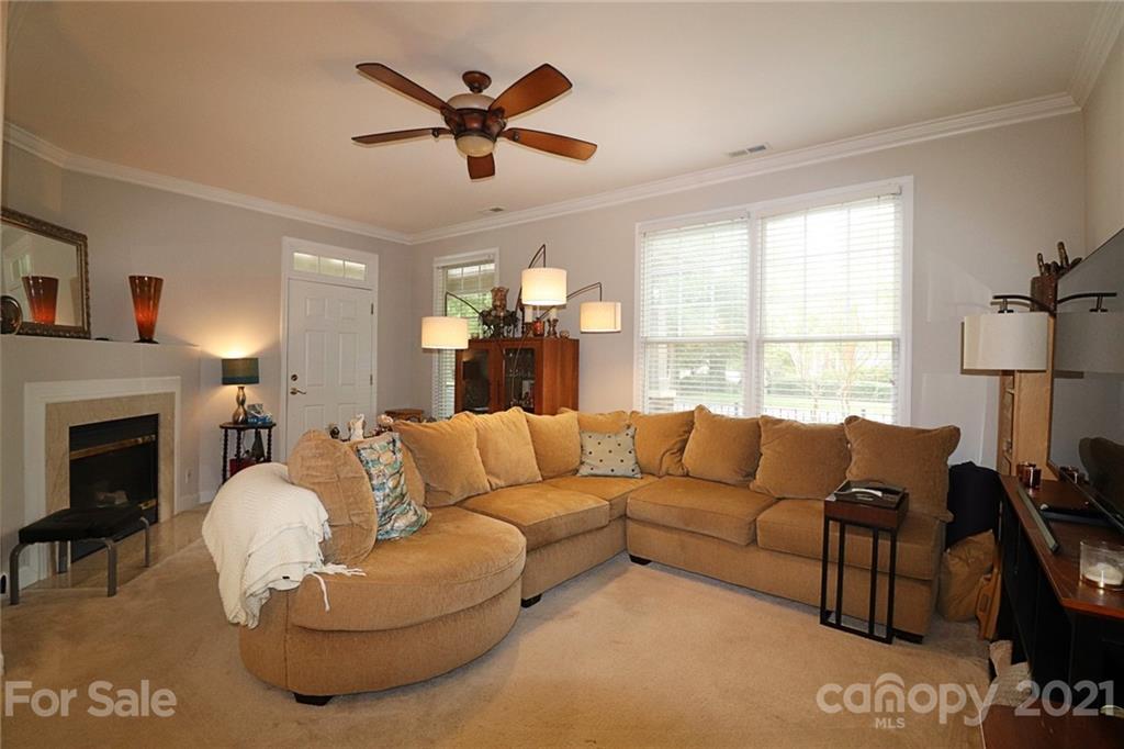 1139 Market Street Fort Mill, SC 29708 - Photo 3 of 17 a living room with furniture a fireplace and a large window