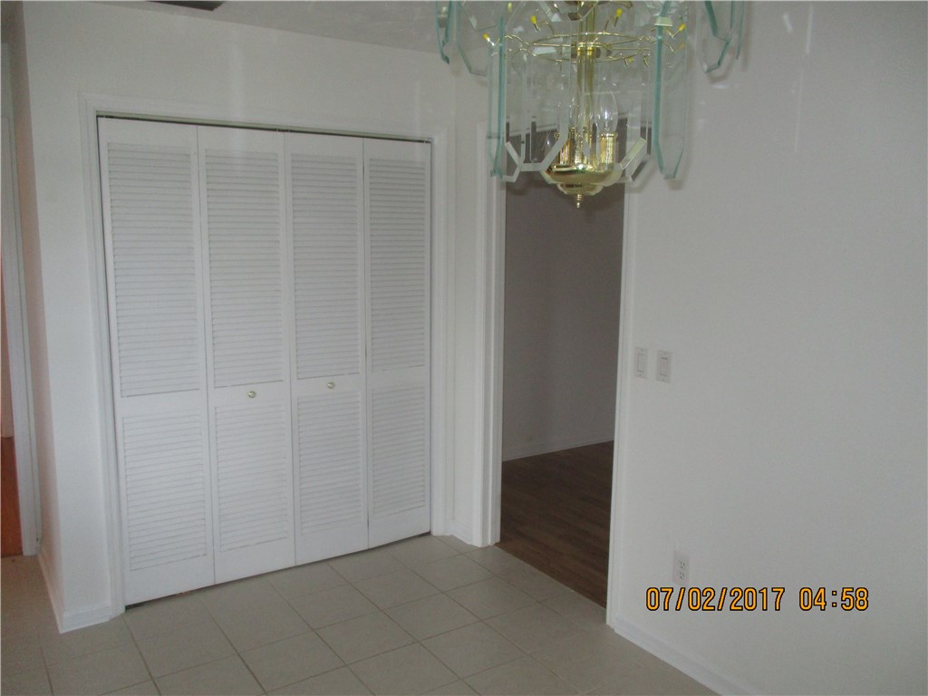 28296 Trigg Road Hilliard, FL 32046 - Photo 24 of 34 a view of a hallway with chandelier