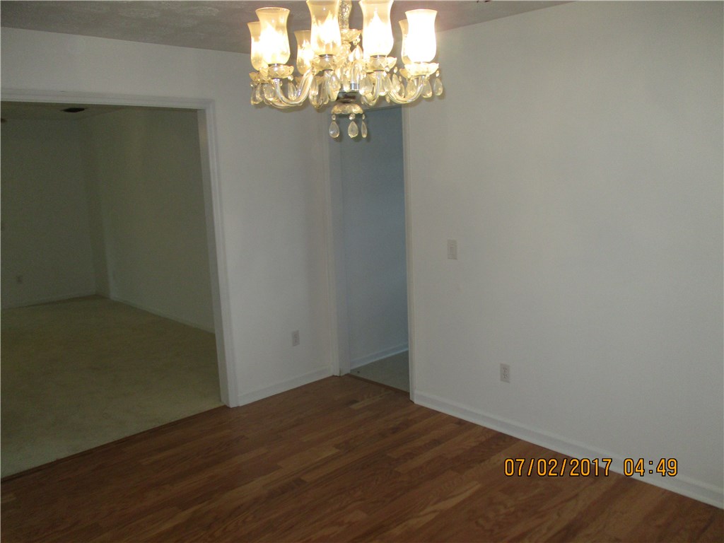 28296 Trigg Road Hilliard, FL 32046 - Photo 5 of 34 a view of a chandelier in big room