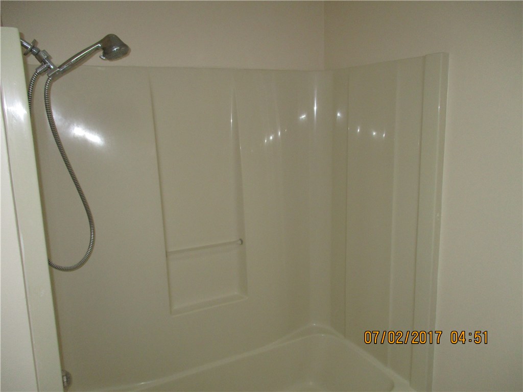 28296 Trigg Road Hilliard, FL 32046 - Photo 8 of 34 a bathroom with a shower