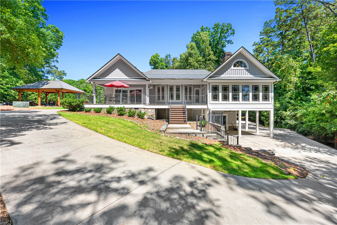 285 Bertha Allen Road Westminster, SC 29693 - Photo 43 of 50 A graceful home nestled in nature with a paved driveway and generous outdoor spaces.