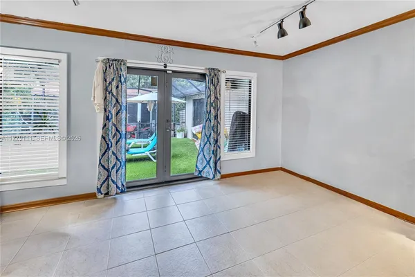 a bed sitting in a room next to a window