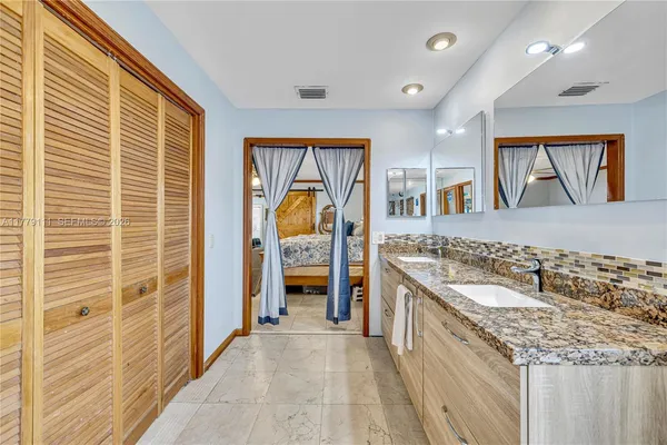 a bathroom with a toilet sink and shower
