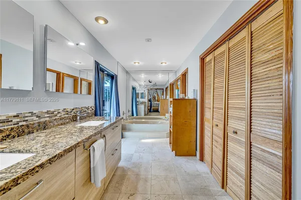 a bedroom with furniture and a chandelier