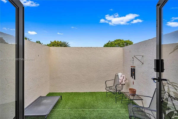 a room with furniture and musical instruments