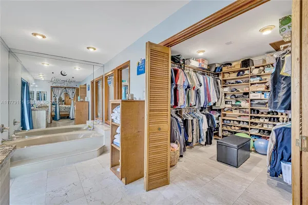 a bathroom with a double vanity sink mirror and double