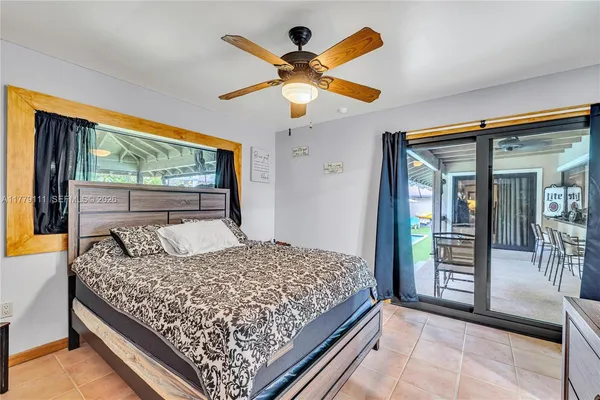 a view of a porch with furniture and a yard